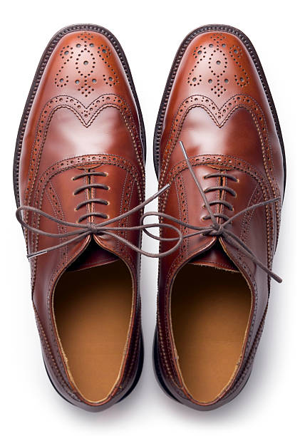 Brogues from above A pair of men's traditional brown shoes isolated on white and shot from above dress shoe photos stock pictures, royalty-free photos & images