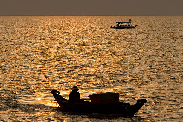 istock boats at sunset on tonle sap 145853683