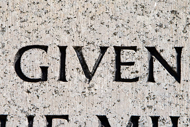 istock Word "Given" Carved in Gray Granite 145854194