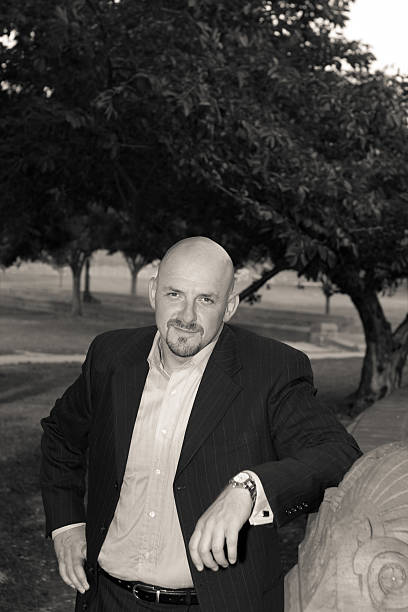 istock Bald Man Goatee In a Park, Black and White 145854211