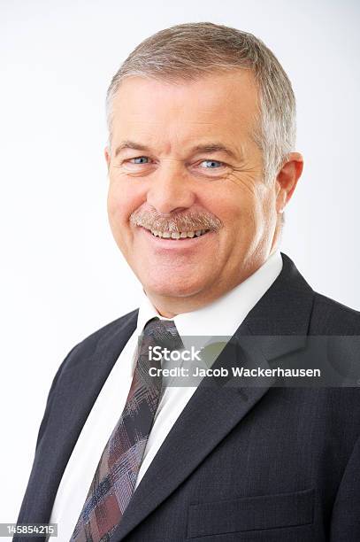 Closeup Of A Senior Businessman Smiling Stock Photo - Download Image Now - Achievement, Active Seniors, Adult