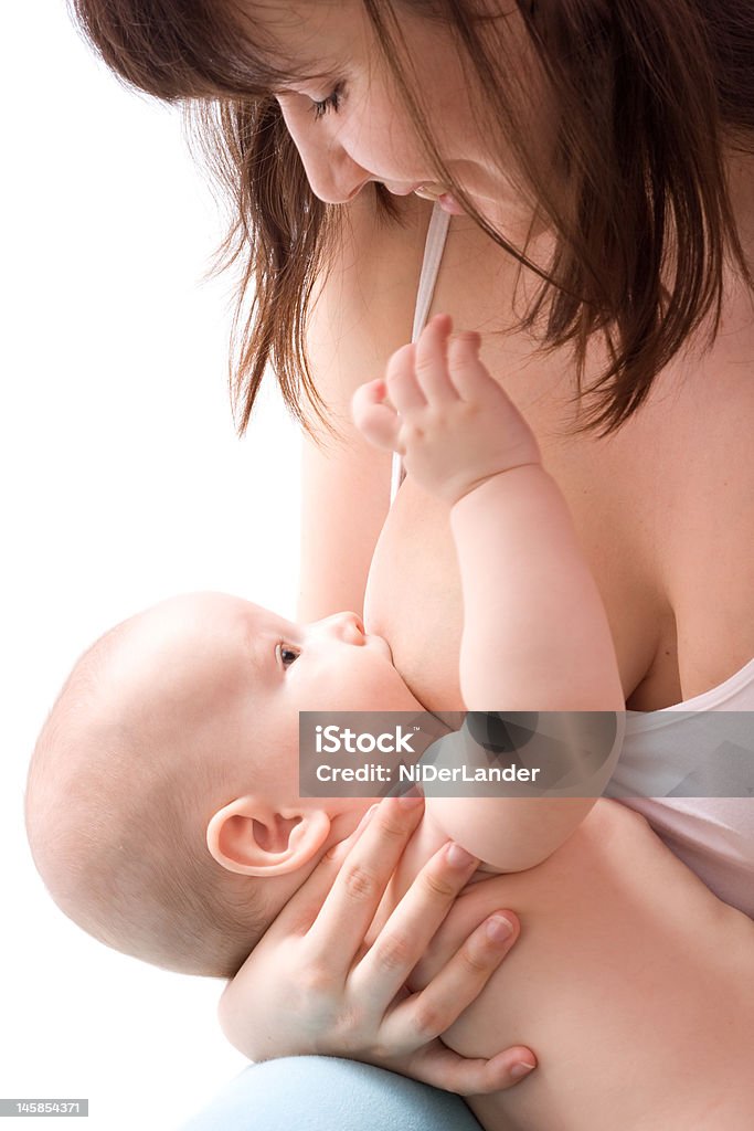 Breastfeeding Breastfeeding. Low DOF, on breast and baby's eye Adult Stock Photo