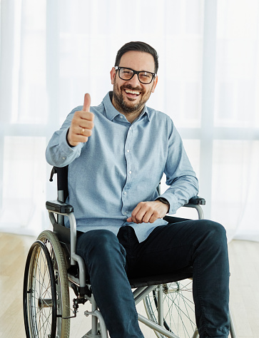 Portrait of a young man in wheelchair