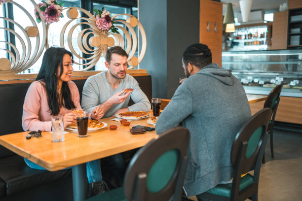istock Friends Catching Up In Local Bar 1458547509