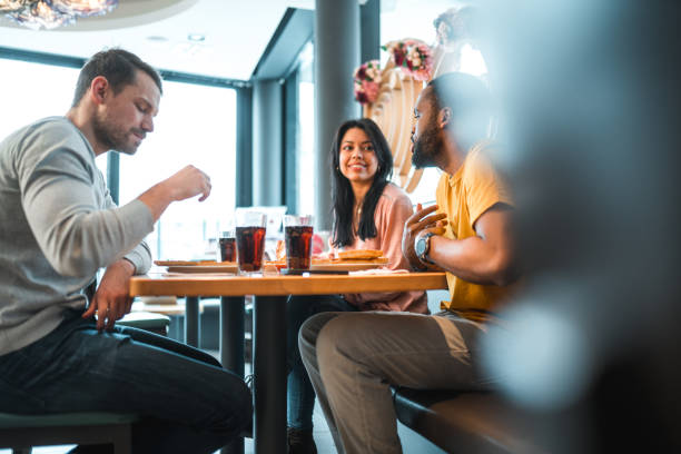 istock Diverse Friends Gathering In A Pizza Place 1458547526