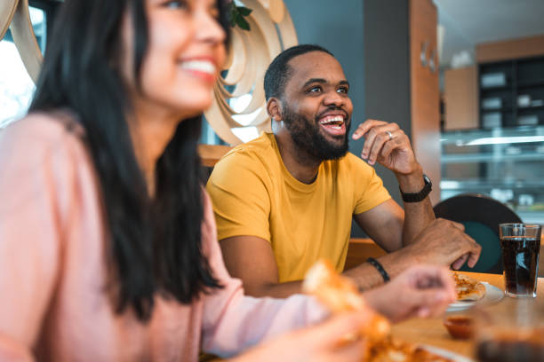 istock Diverse Friends Hanging Out Eating Pizza 1458548230