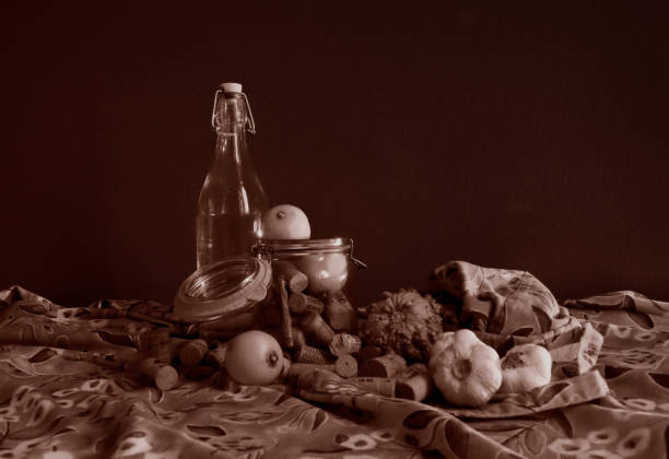 Still life bottle, garlic lemons, etc. Sepia