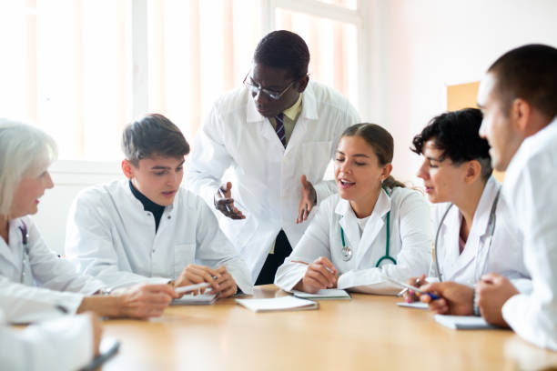 istock Professor explaining subject to group of medical students 1458551666