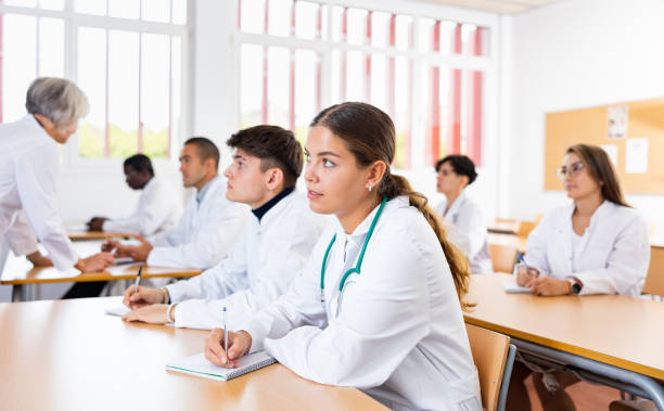istock Portrait of doctors different age who writing exercises at lesson 1458551742
