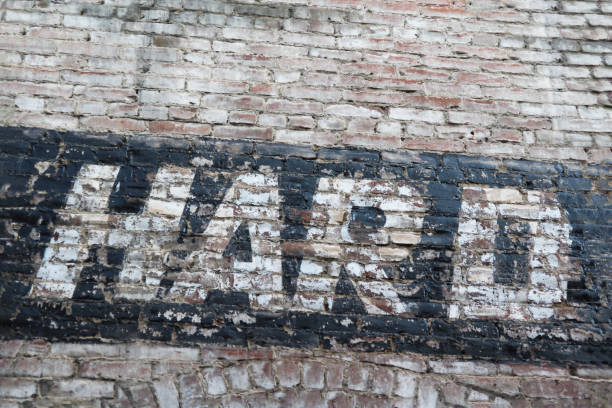 istock The word HARD is painted on an old brick wall. Ghost sign. 1458552660