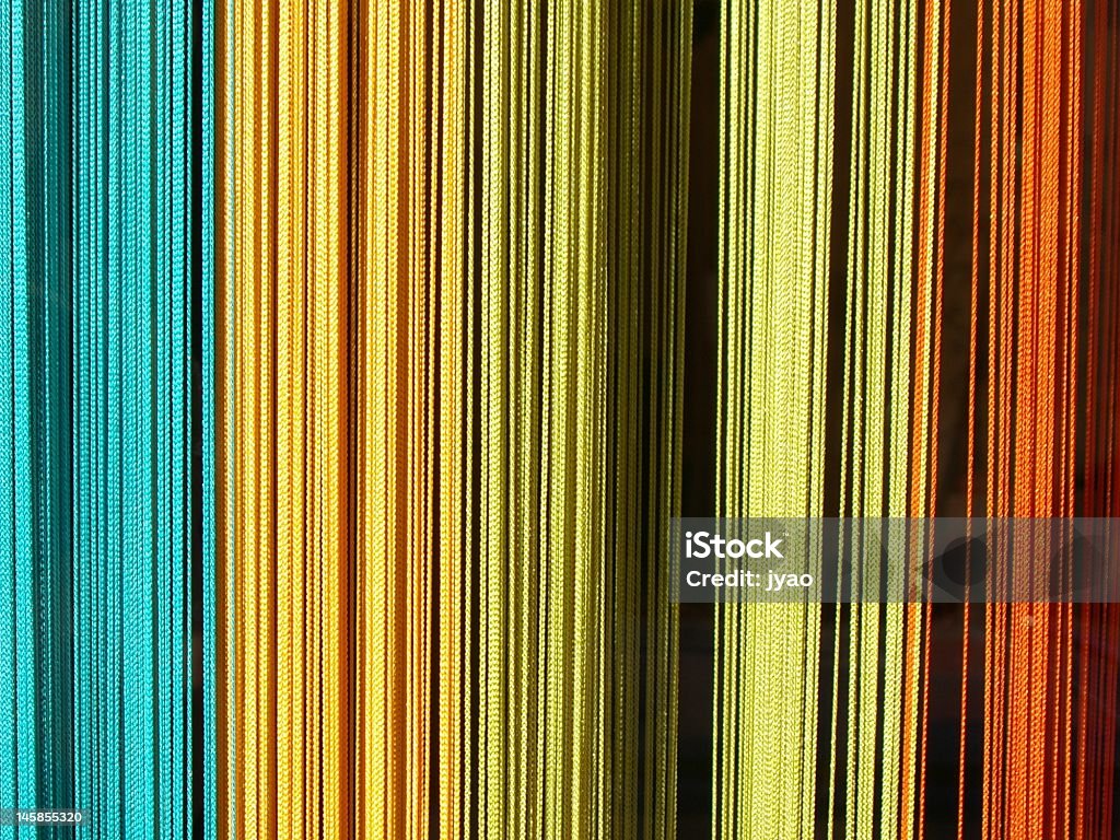 colored curtain Colored curtain behind a shop window at Beaune (Burgundy, France). Beaune Stock Photo