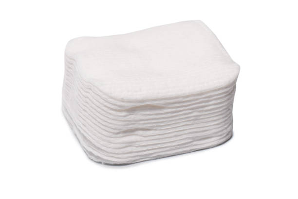 istock Stack of white cotton sponges isolated on a white background. 1458554422
