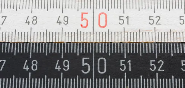 carpenter's ruler with millimeter divisions and numbers in centimeters. Fully extended it measures 2 meters.