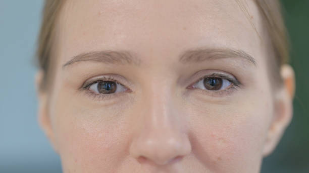 istock Close Up of Blinking Female Eyes 1458556463