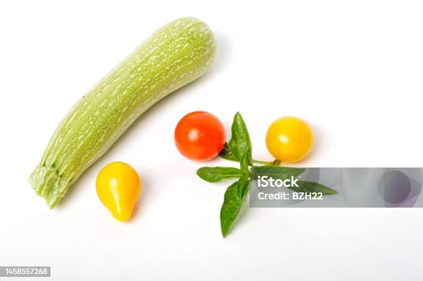 Basil Tomatoes And Zucchini On A White Background Stock Photo - Download Image Now - Basil, Cherry Tomato, Color Image