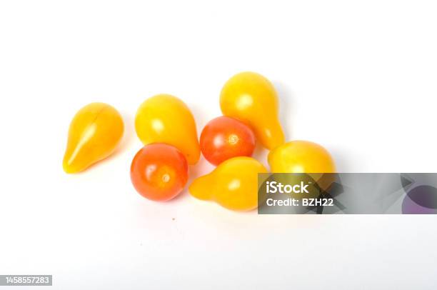 Tomatoes On A White Background Stock Photo - Download Image Now - Cherry Tomato, Color Image, Cut Out