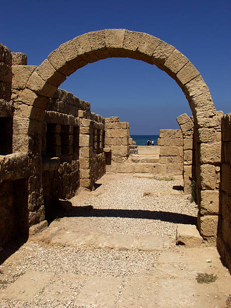 Restored archway in ruins of Caesarea stock photo