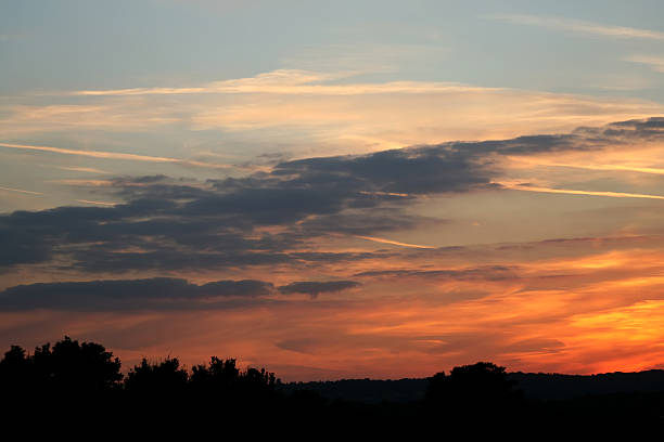 istock orange sky during summer as the sun sets 145856390