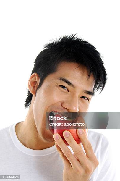 Young Asian Man Stock Photo - Download Image Now - Apple - Fruit, Eating, Men