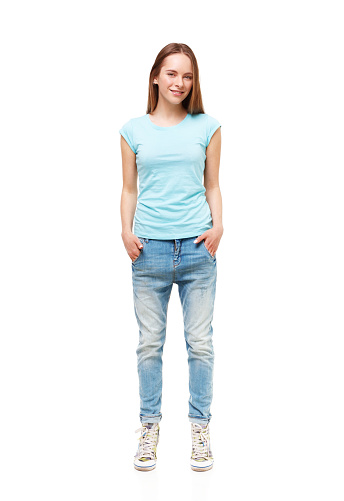 Full length portrait of young girl in casual clothing isolated on white.