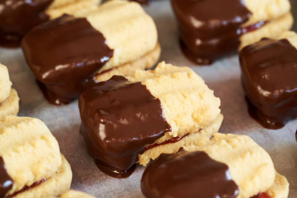istock Christmas cookies filled with jam and dipped in chocolate 1458572018