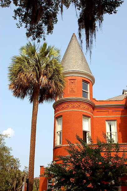 Red castle house with palm tree in Savannah, Georgia stock photo