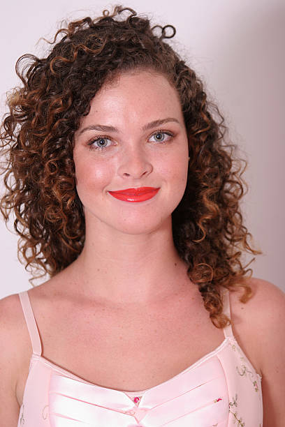 Very pretty female with curly hair stock photo