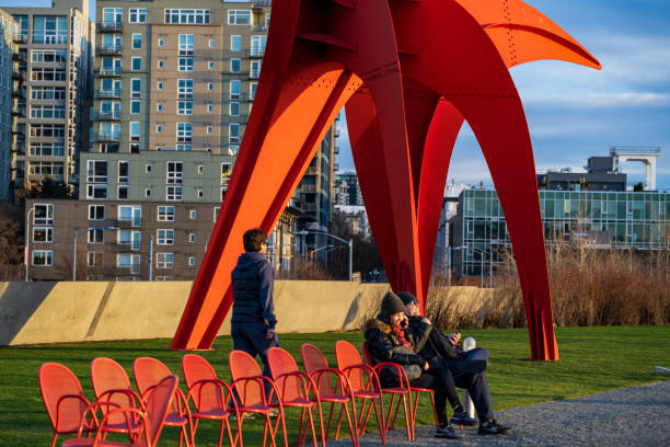 Seattle WA, USA - January 10, 2023:  People enjoy outdoor activities at Olympic Sculpture Park along the beautiful Elliott Bay waterfront.