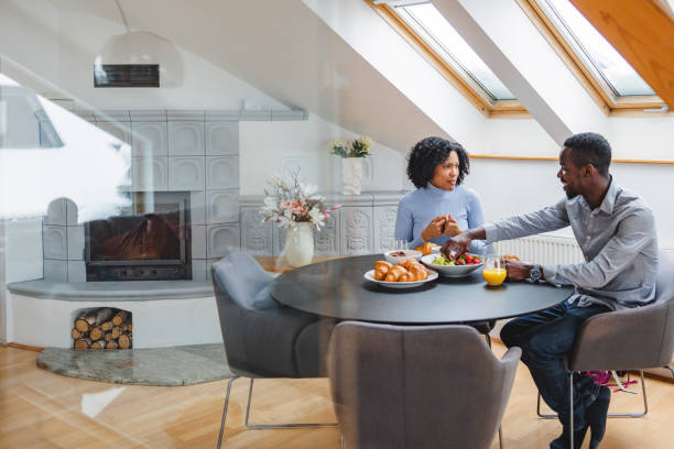 istock Lovely Diverse Couple Spending Time Together Eating Breakfast 1458575478