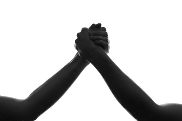 istock Silhouette of hands holding each other 1458575657