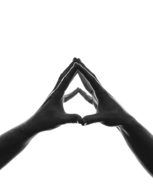 istock Silhouette of hands holding each other 1458575662
