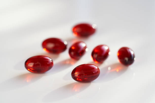 istock Krill oil capsules on a bright background 1458575724
