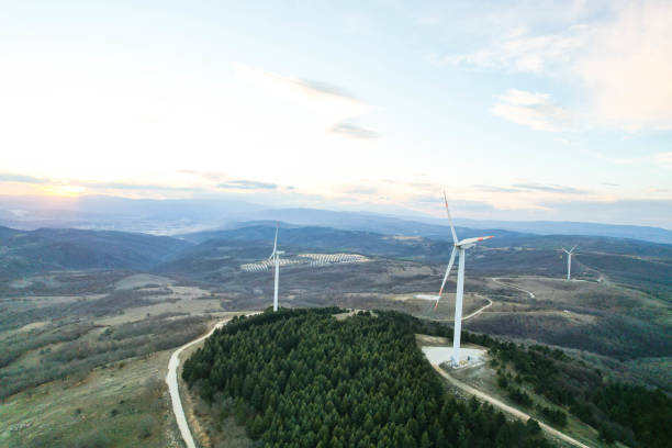 istock solar panels and wind turbines at sunset. renewable energy sources 1458578031