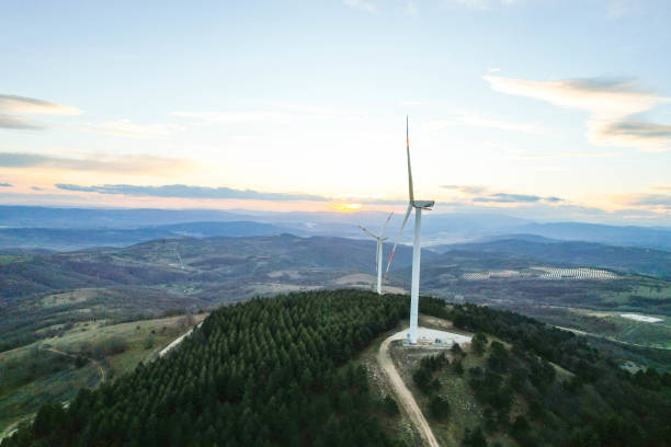 istock solar panels and wind turbines at sunset. renewable energy sources 1458578035