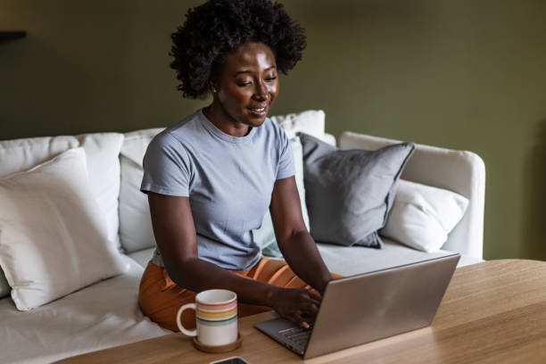 istock A young African-American woman is using a laptop 1458579865