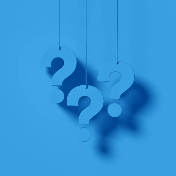 istock Three blue question marks in front of a blue wall background. FAQ Concept. 1458580604