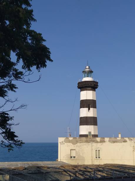 istock Lighthouse by the sea 1458582546
