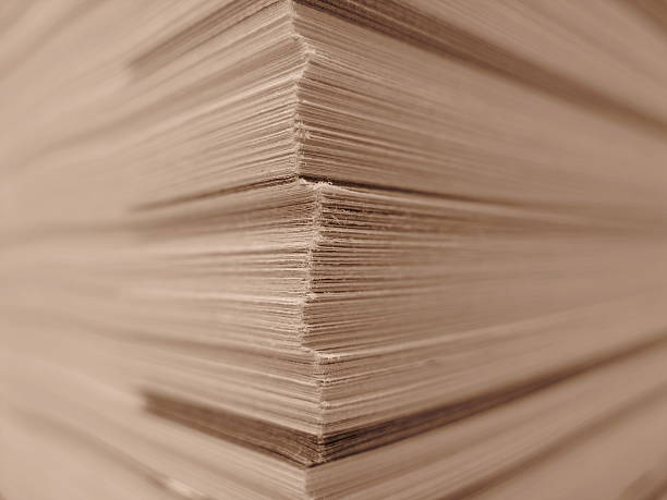 istock phone book - stacked pages sepia toned 145858363