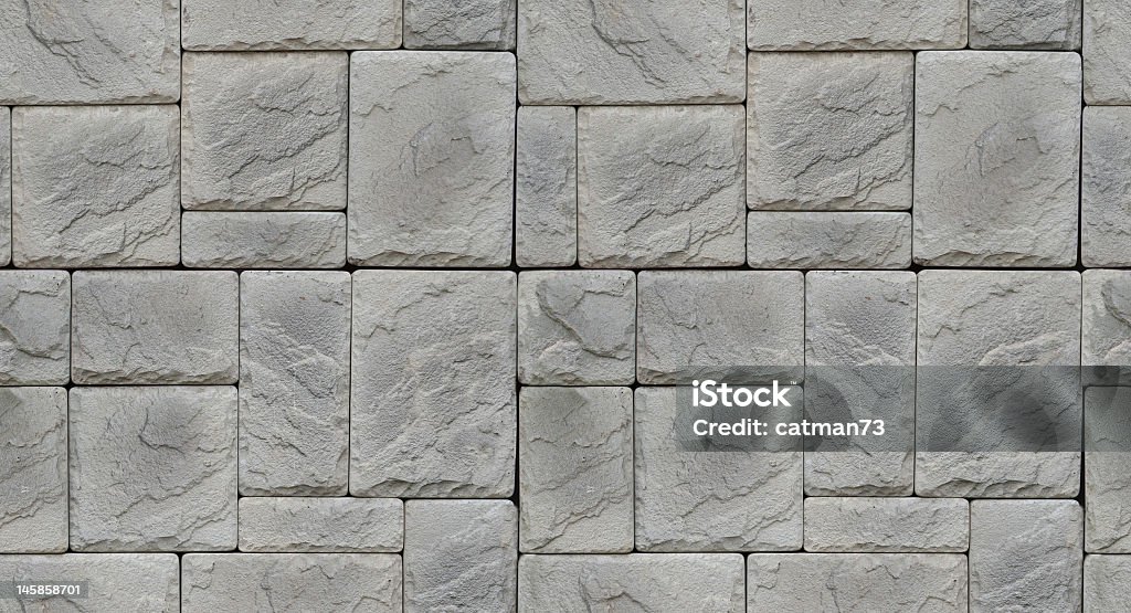 Multi shaped stone gray textured wall Seamless Old Stone wall grey texture Ancient Stock Photo