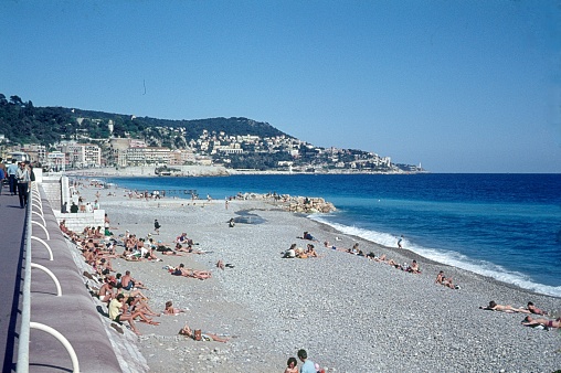 Nice, Cote d'Azur, France, 1972. Beach scene with beachgoers and sunbathers in Nice.