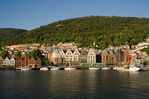 A view of Bergen  and sail boats and it's traditional buildings from across the harbour