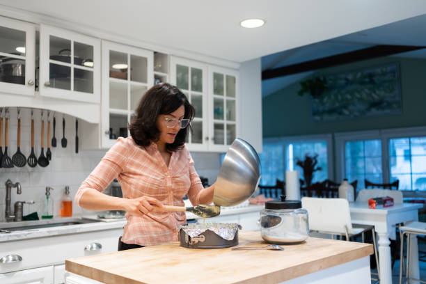 istock Latin woman making a cake at home 1458592668