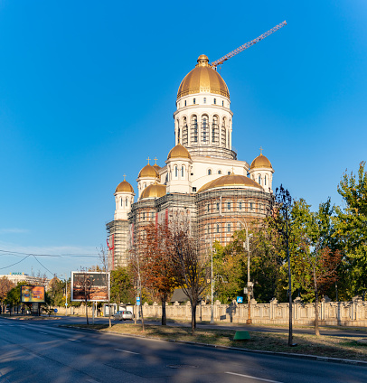 Bucharest, Romania - October 23, 2022: A picture of the Cathedral of the Salvation of the Nation at sunrise in the fall.