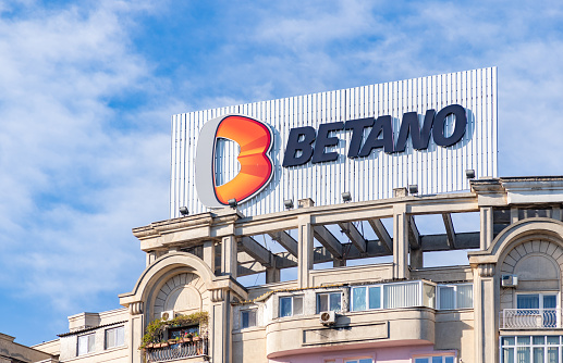 Bucharest, Romania - October 23, 2022: A picture of the Betano sign at the top of an apartment building.