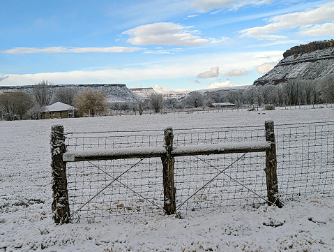 Ranch house and orchard after snowfall in Rockville Utah with Mt Kinesava in the background in Zion National Park