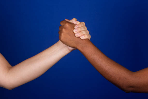 istock female arms and hands on blue background 1458598700