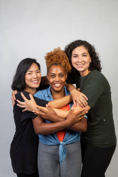 istock Women of various ethnicities embracing 1458598767