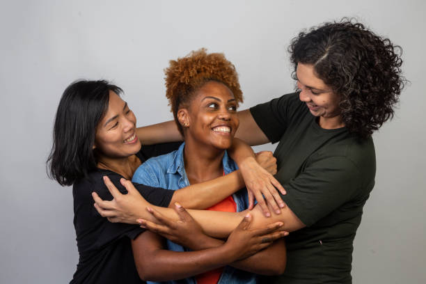 istock Women of various ethnicities embracing 1458598778