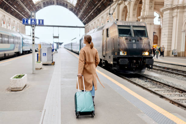 istock Woman walking at the railway station platform 1458602351