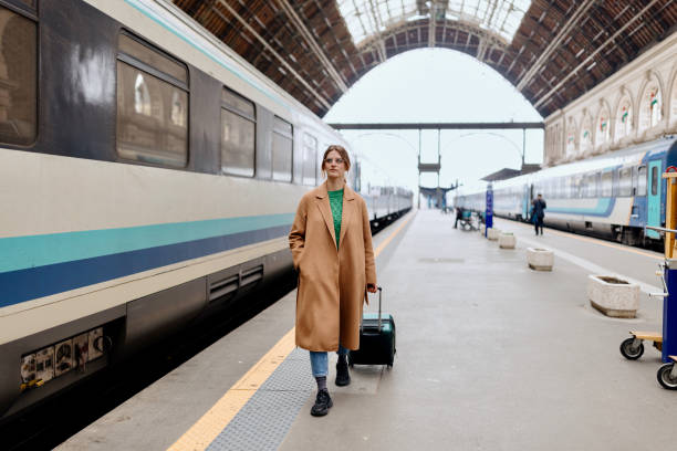 istock Woman walking at the railway station platform 1458602395